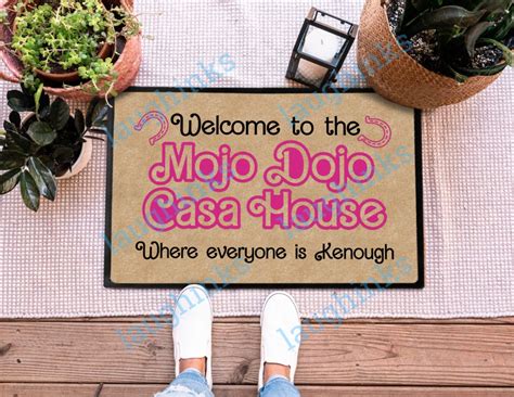 Casa dojo mojo house. Welcome to the “Welcome to My Mojo Dojo Casa House” Doormat by Rockatee. This stylish and functional doormat is the perfect way to greet guests and keep your home clean. Measuring 24″ (L) x 16″ (W), this rectangular doormat is the ideal size for any entryway. It’s approximately 3/16″ thick, providing a comfortable surface for you ... 