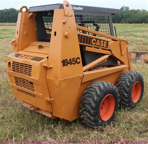 The Case 75XT is equipped with a single reduction final drive, 100HS continuous roller chain, and 10x16.5 tires. The skid steer loader has a maximum lift height of 119.7" (3040 mm) to hinge pin and dump height of 90.6" (2300 mm). The rated operating capacity is 2200 lbs (998 kg), and tipping load is 4400 lbs (1996 kg).. 