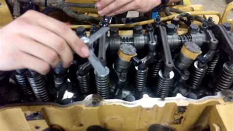 Cat c13 valve adjustment.  It describes the process which includes putting the engine i...