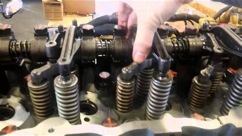 Hold the adjustment screw in this position and tighten locknut (3) to a torque of 100 ± 10 N·m. (74 ± 7 lb ft). 8. To make an adjustment to the unit injectors on cylinders 1, 2, and 4, remove the timing bolt. Turn the flywheel by 360 degrees in the direction of engine rotation. The direction of engine. 