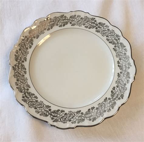 Cathedral bavaria china bridal rose. Vintage Cathedral Bavaria West Germany Bridal Rose Dinner PlateThis pattern features platinum roses all along the edges and a platinum rim. The edges are scalloped which makes it unique.The plate meas 
