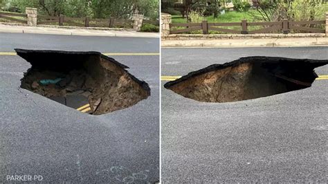 Caught on video: Large sinkhole forms in middle of road in Parker