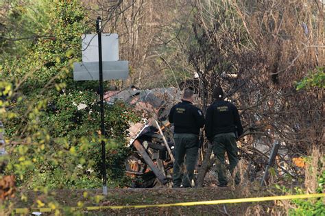 Cause sought in explosion that leveled an Arlington, Virginia, home as police tried to serve warrant