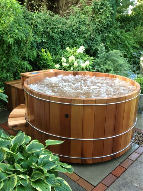Cedar hot tub. This deluxe package is designed for a stand-alone design and includes the following: Ceda Ofuro Cedar Wood Hot Tub (2 Person) 40mm thick A Grade Clear Western Red Cedar Hot Tub (1750mm x 900mm x 760mm Tall) 50mm Stainless Steel Straps. 4” thick marine-grade vinyl cover with locks. Balboa Electric Spa pack and Heater. 