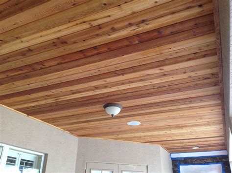 Cedar tongue and groove ceiling. A Cedar Tongue And Groove Ceiling refers to a ceiling design where cedar planks are fitted together using a tongue and groove system. The tongue-and-groove feature involves one side of the plank having a protruding edge (tongue) that fits into a groove on the other side, creating a seamless and visually appealing surface. 