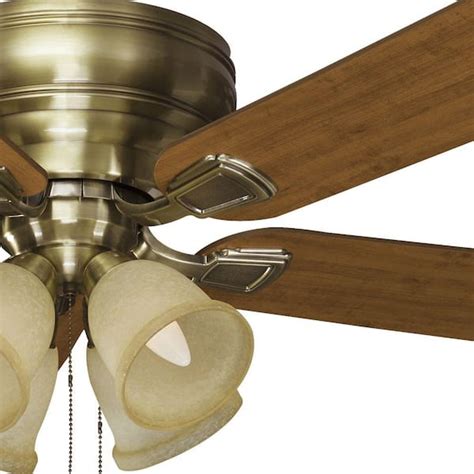 The Hampton Bay 52-in. Southwind brushed nickel ceiling fan includes five reversible blades in cherry and maple finishes and a remote control with manual reverse function. The sleek housing complements many different decors while functioning quietly in whatever setting it is installed.. 