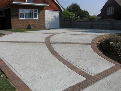 Cement driveway cost. The cure time for a concrete driveway is about 28 days under optimal warm-weather conditions. This length of time should cure the concrete sufficiently to a hardness of 4,000 psi, ... 