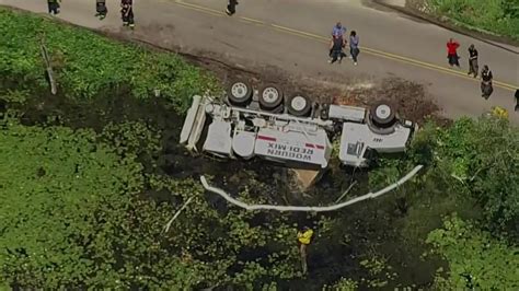 Cement truck ends up in pond after rollover at Andover/North Andover town line