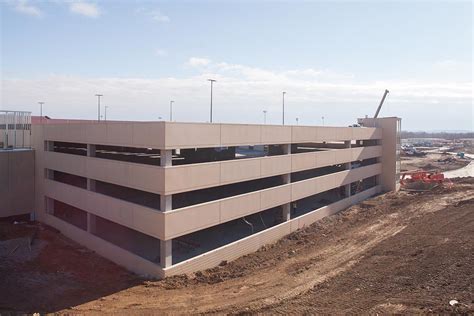 Central district parking garage ku. In 2015, the University of Kansas embarked on a major construction program to replace and add buildings to their main Lawrence campus. The project redeveloped an under-utilized 55-acre central campus site, adding a 280,000 SF Integrated Science Building, a new satellite Student Union, a 600-space parking structure and a 4,000-amp Central Utility Plant, capable of supporting both new and future ... 
