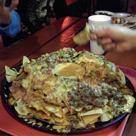 Chachos nachos. Feb 9, 2023 · Directions. Adjust oven rack to center position and preheat oven to 375°F (190°C). Heat oil in a large wok or Dutch oven to 350°F (177°C). Add 1/3 of tortilla chips and cook, agitating and flipping them constantly with a wire mesh spider until bubbles slow to a trickle and chips are pale golden brown, about 2 minutes. 