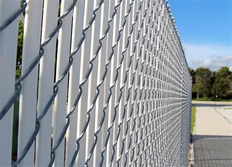 Chainlink privacy fence. Fence Slats provide 85% privacy in 2 in. diamond chain link, 80% privacy in 2-1/4 in. diamond chain link, and 75% privacy in 2-3/8 in. diamond chain link. Colors available: Beige, Green, Redwood, White, and Black. Each slat measures 1.25 in. wide. High Density Polyethylene (HDPE) material with UV inhibitors are resistant to severe weather ... 