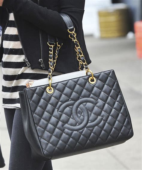 Chanel grand shopping tote. Marc Jacobs is a renowned fashion designer who has been in the industry for over 30 years. His brand is known for its luxury and high-quality products, including handbags. One of t... 