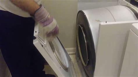 Changing the belt on a whirlpool dryer. Step 40 Remove the drum. Use the belt to lift the drum a few inches. Swing the drum out of the front of the dryer. Note which end of the drum faces the front. If the belt is broken, stand in front of the drum and put your arms inside it. Lift it up and pull it through the front opening of the machine. 