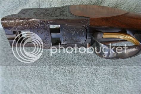 View sold price and similar items: B. C. MIROKU CHARLES DALY DIAMOND 12 GAUGE SHOTGUN. from James D. Julia on March 5, 0118 10:00 AM EDT. SN S343588. Cal. 12 ga. 28" bbl, 2-3/4" chambers. Chokes IMP cyl / mod. Full length, low profile, matted, ventilated top rib with white plastic mid bead and neon green front bead. Gold plated single s.