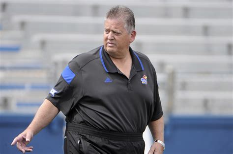 Kansas head football coach Charlie Weis goes over his depth chart and other changes to his team with an audience of media members on Wednesday, Aug. 7, 2013. ... are well-coached and recruiting ...