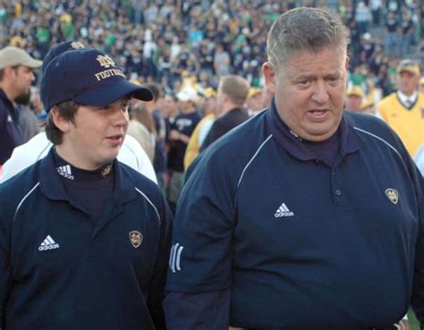 Notre Dame Head Coach Charlie Weis. On h
