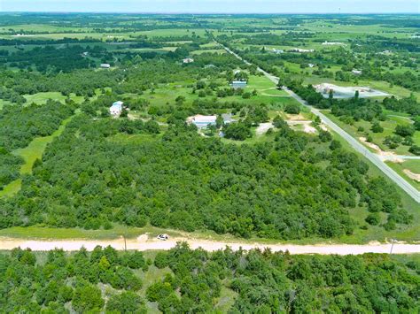 0.27 Acre Unrestricted Wooded Lot with Electric Water