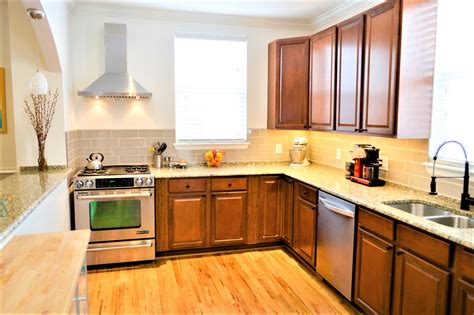 Cheapest cabinets. The average kitchen cabinet costs start at $100 per linear foot. Here’s a look at additional projects and costs: Custom cabinets cost $500 to $1,200 per linear foot. Stock cabinets cost $100 to $300 per linear foot. Cabinet repairs cost between $130 and $470. Full cabinet installation or replacement costs $5,110. 