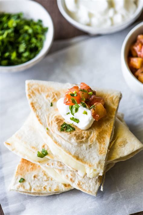 Cheese for quesadillas. Place the tortillas on a greased baking sheet. Combine the cheese and salsa; spread over half of each tortilla. Fold tortilla over. Broil 4 in. from the heat for 3 minutes on each side or until golden brown. Cut into wedges. 