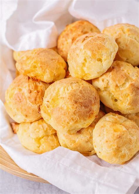 Cheese puffs. PUFFS. In a saucepan, over medium heat, melt the butter, sugar and salt in the water. Bring to a slow boil. Add the flour. Stir continuously until the mixture comes from the bottom of the pot ... 