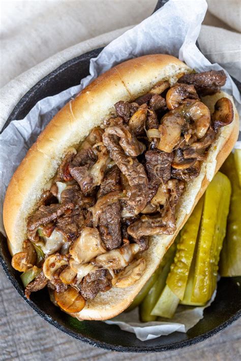 Cheesesteak meat. Heat the olive oil in a large skillet over medium heat. Add the onions to the pan and cook for 4-5 minutes until translucent and beginning to turn golden brown. Transfer the onions to a bowl. Add the steak to the pan. Cook until brown and no longer pink, approximately 4-5 minutes. 