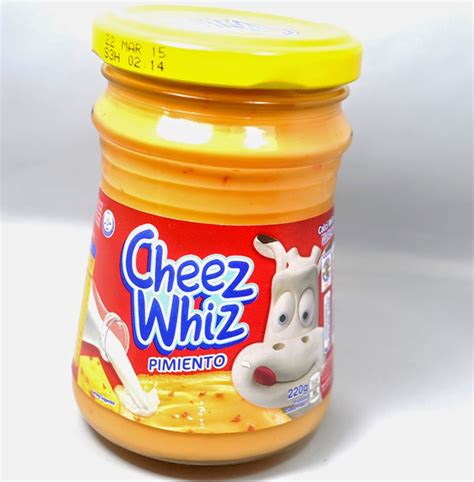 4. Heat the Cheez Whiz in a microwave-safe b