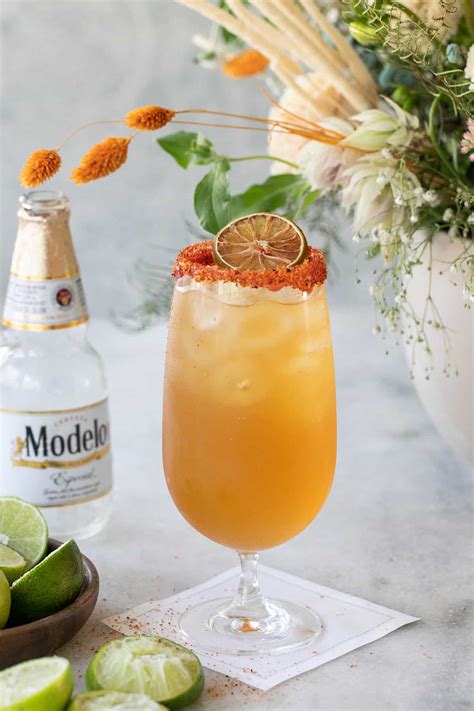 Chelada. Ingredients: Modelo Chelada Tamarindo Picante, 2 oz of tequila, 1 oz of grapefruit juice, 0.5 oz of lime juice, a pinch of salt. Recipe: Rim a highball glass with tamarind powder and fill it with ice. In a shaker, combine tequila, grapefruit juice, lime juice, and salt with ice. Shake well and strain into the glass. 