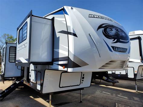 Forest River Cherokee Arctic Wolf Suite fifth wheel 3990 highlights: Loft Dual Entry Doors Fireplace Kitchen Island Coffee Bar Pass-Through Storage... #08281 New 2021 Forest River RV Cherokee Arctic Wolf Suite 3990 Fifth Wheel at Brown's RV Superstore | McBee, SC | #08281 . 