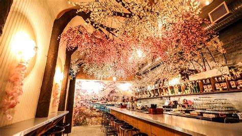 Cherry blossom cafe. Bandesign clads a Japanese cafe in mirrors to reflect a row of cherry trees. A bank of cherry blossoms are mirrored in the reflective gables of this cafe that angles around a smaller tree in Gifu ... 