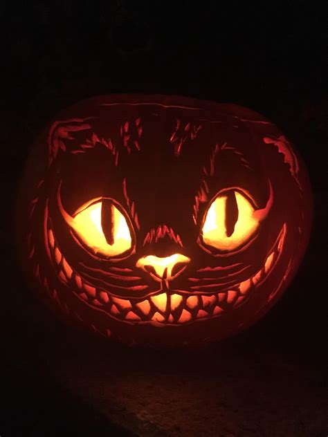 Cheshire cat pumpkin. Place your printed pumpkin carving cat stencil on top of a sheet of graphite transfer paper. Use 4 push pins in the corners to attach the papers to your pumpkin. Firmly write over the lines of the ... 