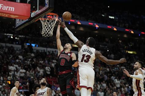 Chicago Bulls let a late lead slip away in 102-91 loss to the Miami Heat, ending their season 1 win shy of a playoff berth