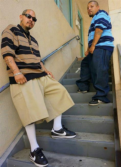 Chicano mexican gangster outfit. In the 60s and 70s, the zoot suit evolved into the more casual and contemporary Chicano look: baggy jeans, oversized flannels, bandanas, grey-and-black-striped polos, etc. Bandana tops have recently made a "comeback" in the fashion world, raising a few divisive questions: Why does it take a white, "conventionally-attractive" model to convince so... 