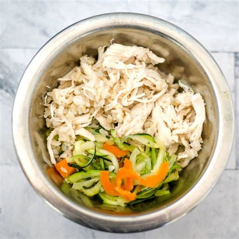 Chicken dog rice. Remove from heat and let the rice cool completely. It's essential to serve cool food to your dog, so make sure both the chicken and rice have cooled down before feeding them. To aid digestion and stop diarrhea, aim for a ratio of 1 1/2 to 2 cups of rice for every 1 cup of chicken. 