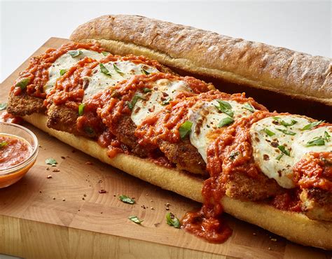 Chicken parm sub. Preheat the oven to 350ºF. Use a sharp knife to cut the chicken breasts in half lengthwise, making 4 thinner pieces of chicken. In a shallow bowl, lightly beat the egg with a splash of water. In another shallow bowl, combine the breadcrumbs, Parmesan, oregano, thyme, onion powder and garlic powder. Season with salt and pepper. 