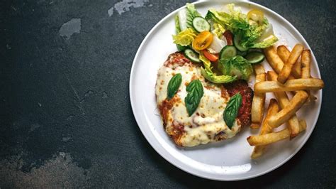 Chicken parmi and chips recipe : SBS Food