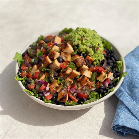 Chicken protein bowl qdoba. Low-Cal Chicken Grain Bowl (gluten free, 480 calories)—this tasty bowl includes grilled adobo chicken, seasoned brown rice, fresh romaine and black beans, along with hand-smashed guacamole, freshly-made pico de gallo and roasted tomato salsa 