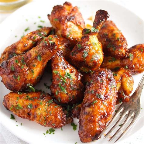 Chicken wings frozen. Cook for 25 minutes at 380°F. Turn the wings over at the 15 minute mark. If using frozen wings, increase cooking time to 30 minutes. When the time is up, increase the air fryer temperature to 400°F and cook for 5 more minutes until the skin becomes brown and crisp. 