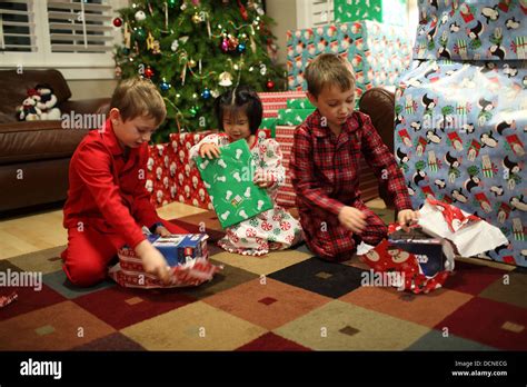 Child Opens All Christmas Gifts