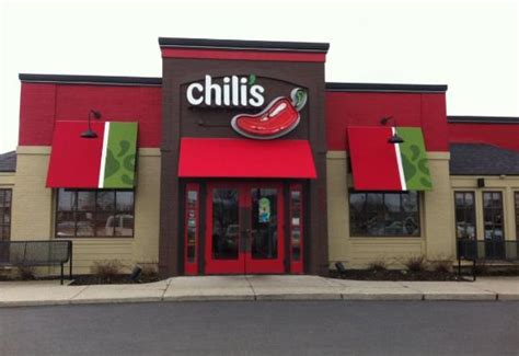  Damaged Chili's Grill & Bar restaurant following a tornado in Round Rock, Texas, U.S., on Tuesday, March 22, 2022. There were 22 reports of... Vehicles sit parked outside a Brinker International Inc. Chili's Grill & Bar restaurant in San Antonio, Texas, U.S., on Monday, May 7, 2018. . 