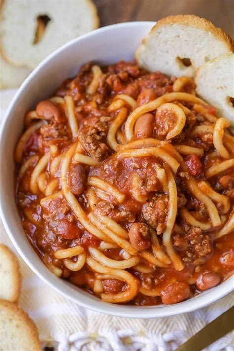 Chili pasta. Cook spaghetti according to the directions on the package, until it is al dente. Strain spaghetti and place in a large serving dish. Add minced garlic, chili pepper flakes, olive oil, salt, and ... 