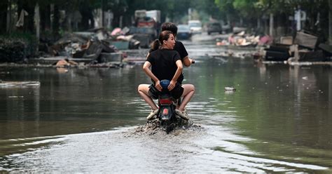 China’s Xi calls for measures to mitigate disastrous flooding amid economic slowdown