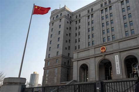 China sentences elderly US citizen to life in prison on spying charges