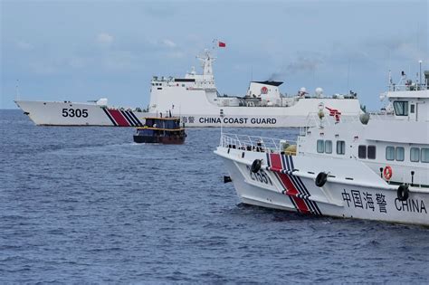 Chinese coast guard claims to have chased away Philippine navy ship from South China Sea shoal