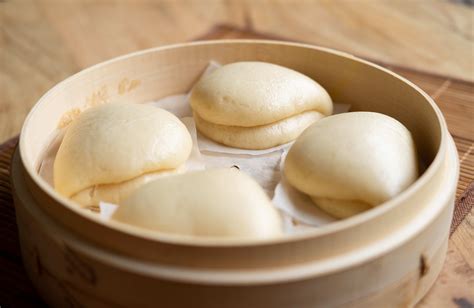 Chinese steamed buns. In a large bowl, combine ¾ lb ground pork, the sliced scallion, and the minced shiitake mushrooms. Squeeze out the excess water from the cabbage with your hands and add it to the bowl. Grate the ginger and add 1½ tsp ginger, grated (with juice), to the pork mixture. 