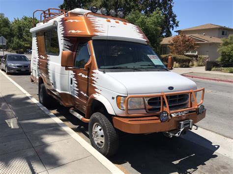 2001 CHINOOK BAJA, This used 2001 Chinook Baja 4x4, This unit is a 4-wheel drive with a winch on the front. It has a great floor plan with a cozy sleeper sofa and a TV above the cab. In addition, there is a booth dinette for dining, entertaining and additional sleeping quarters.. 