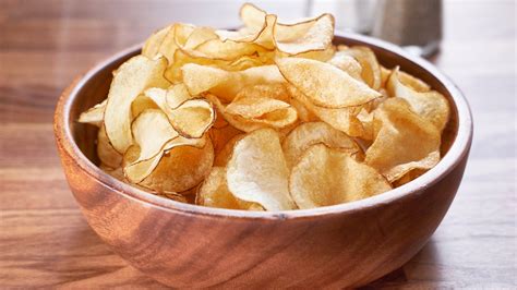 Chips salt & vinegar. In a large bowl add oil, salt, and vinegar and mix around. Coat each piece lightly with mixture. Place the pieces on the dehydrator racks. Make sure they do not overlap each other or they will not dry right. Place the lid on and dehydrate for 7-10 hours on 130 degrees. The chips will be dry and crisp when they are done. 