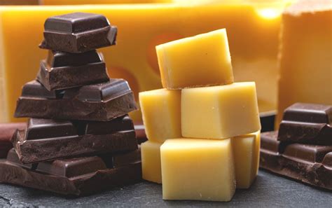 Chocolate and cheese. Chocolate's daily need coverage for Copper is 111% higher. Cheddar Cheese contains 57 times less Iron than Chocolate. Chocolate contains 8.02mg of Iron, while Cheddar Cheese contains 0.14mg. The amount of Cholesterol in Chocolate is lower. The food types used in this comparison are Chocolate, dark, 45- 59% cacao solids and Cheese, cheddar. 