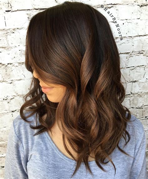 Chocolate brunette hair color. When requesting “chocolate cherry” at the salon, a client with a deep brunette base can expect to receive a series of red-violet glosses fine-tuned to what will get the hair to that perfect ... 