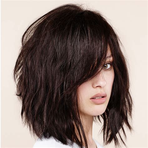 15. Choppy Bob With Bangs. @salsalhair. This cute and edgy choppy bob has lots of volume and face-framing, so it’s as flattering as it’s trendy. Tip: when getting layers near the face, make sure you don’t go too short—cheekbone-length is usually as short as you can go to avoid a bulky-on-top look. 16.. 