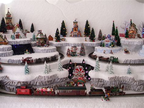 Christmas Village Display Platforms DIY Using the display shelf to turn them into a Christmas decoration corner is a great Christmas village display ideas. Take advantage of the space of the shelves to design and decorate perfectly for small corners in the house, creating a miniature village to create a lively and outstanding scene in your ... . 